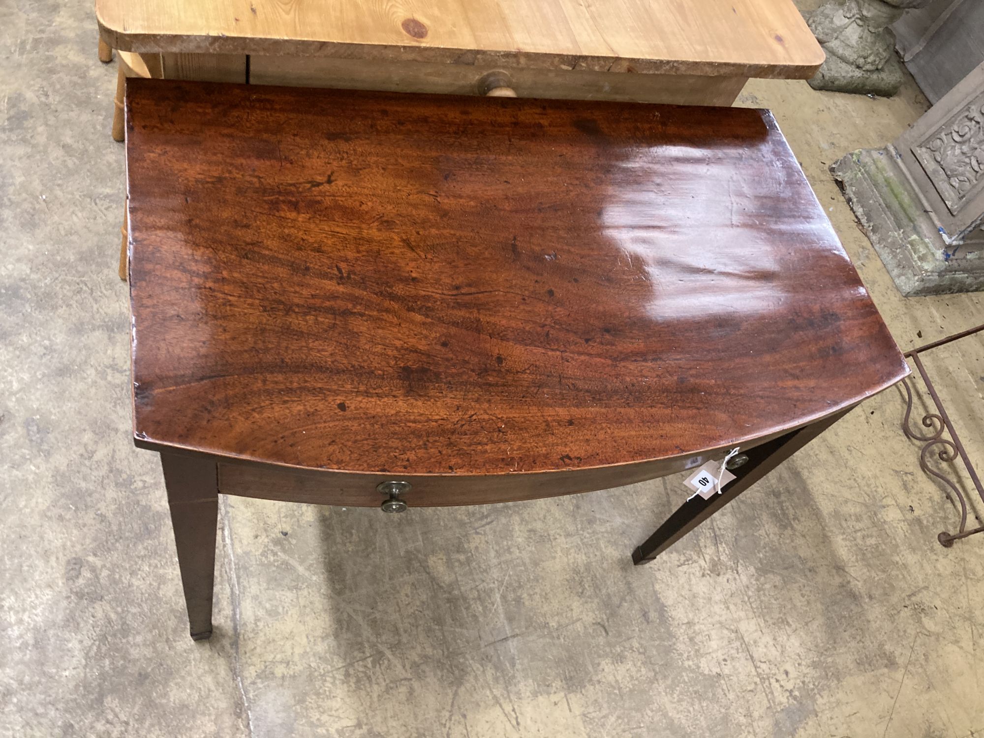 A George III mahogany bow front side table, width 84cm, depth 51cm, height 71cm